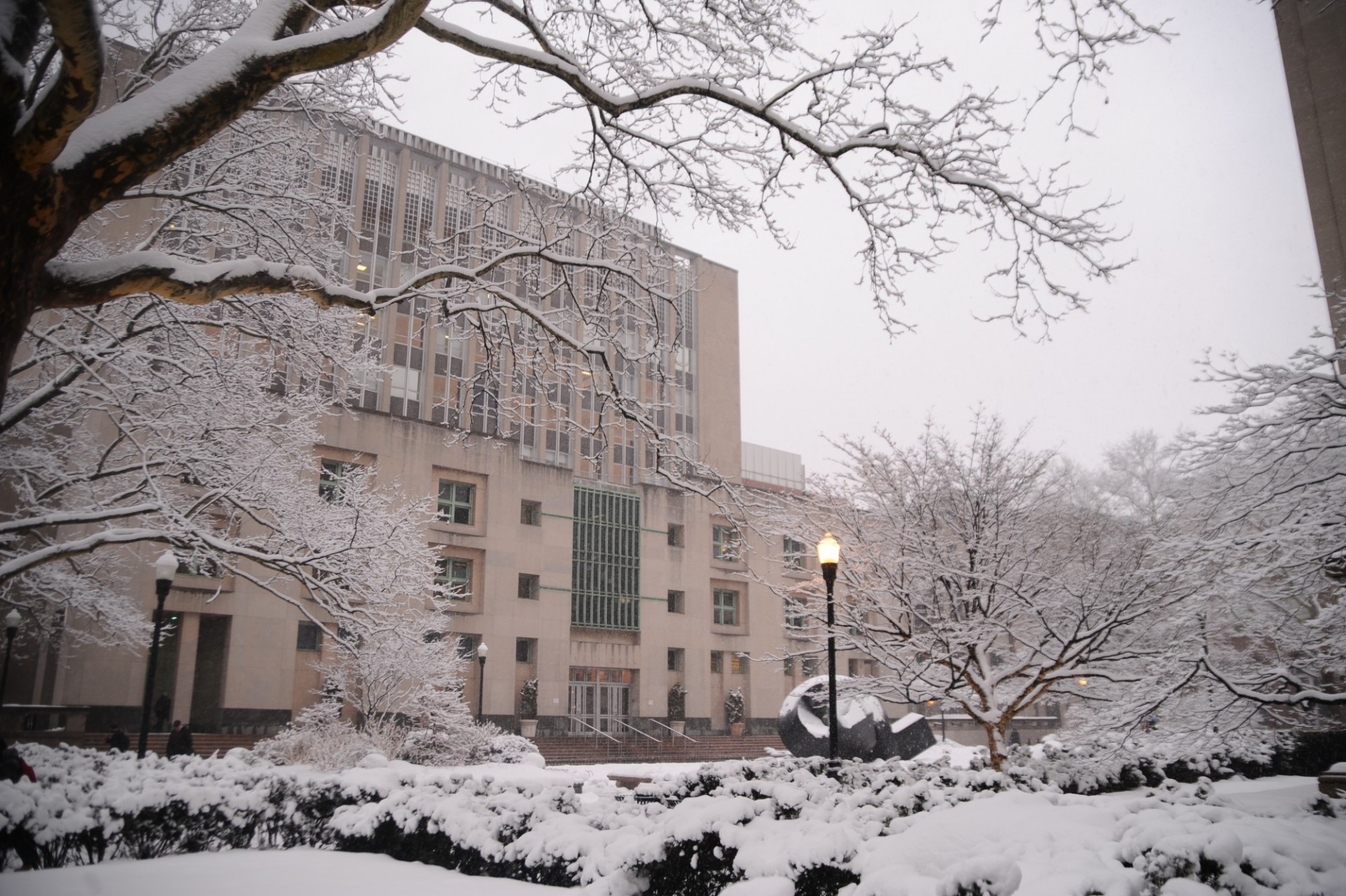 Uris Hall during the winter, surrounded by snow.