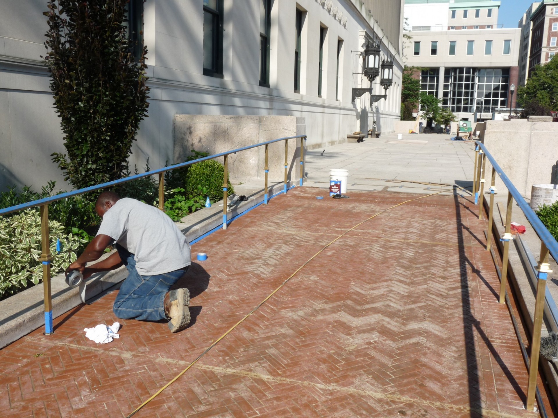 Final preparations being made to the Butler Plaza east walkway in preparation for the library's main entrance to reopen on Sept. 5