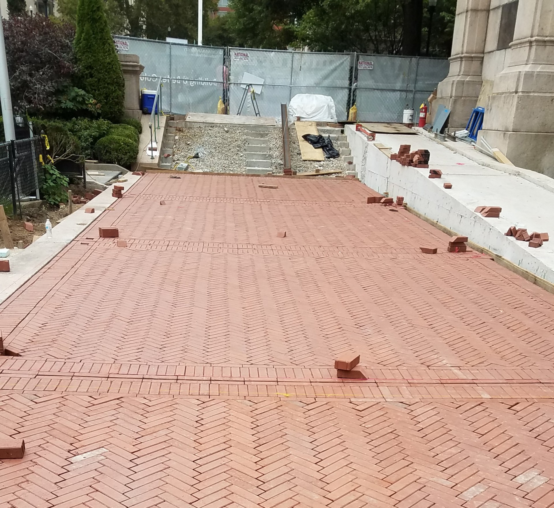 The Lower Campus accessibility ramp project includes the replacement of granite stairs and brick pathway. 