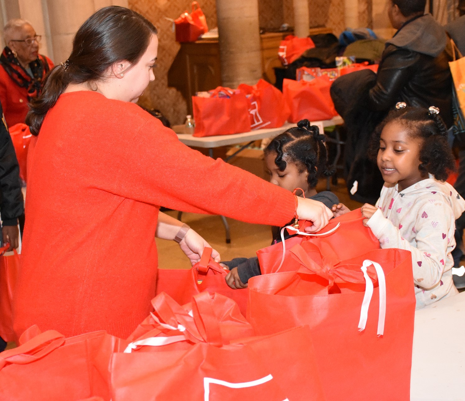 Volunteers giving out toys