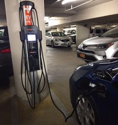 Charging station in use with electric vehicle
