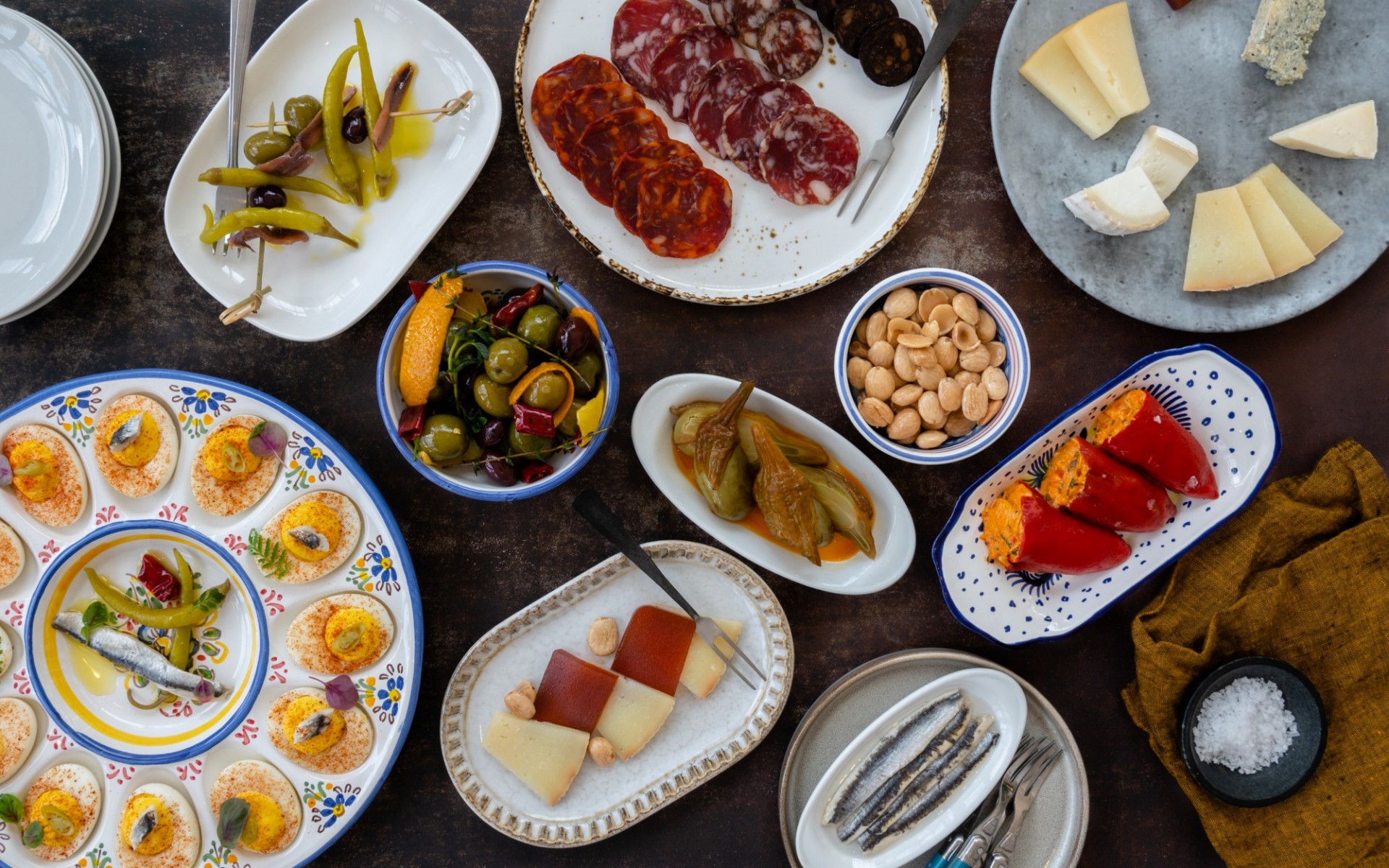 A selection of cured meats, cheese, deviled eggs, and peppers available at Olivia.
