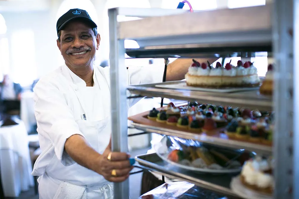 Columbia Dining employee with cart full of food