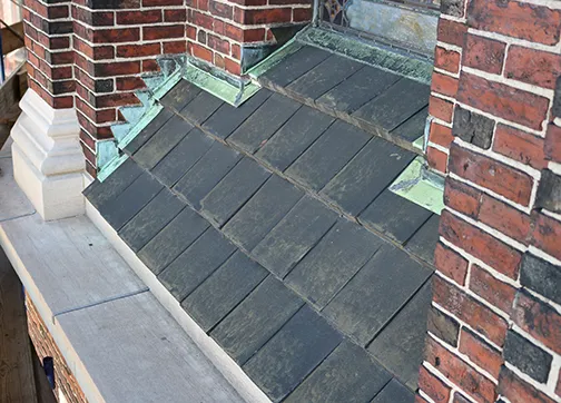 The historic terra cotta tiles will be replaced with precise reproductions using the original tile molds