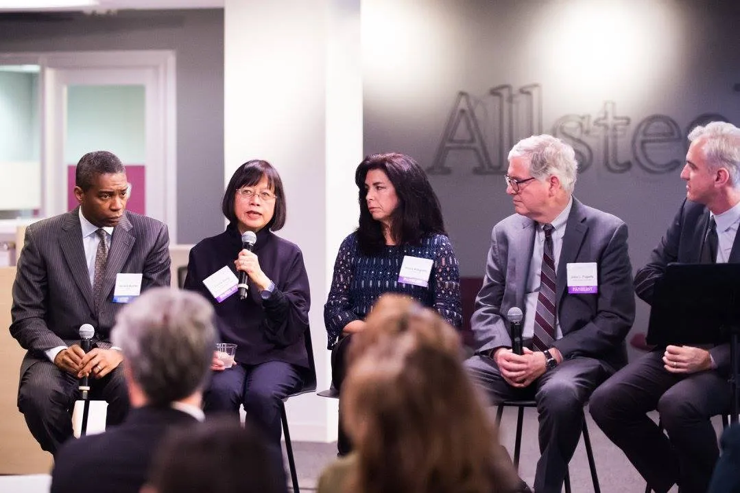 Fanny Gong participating in panel discussion on higher education construction.