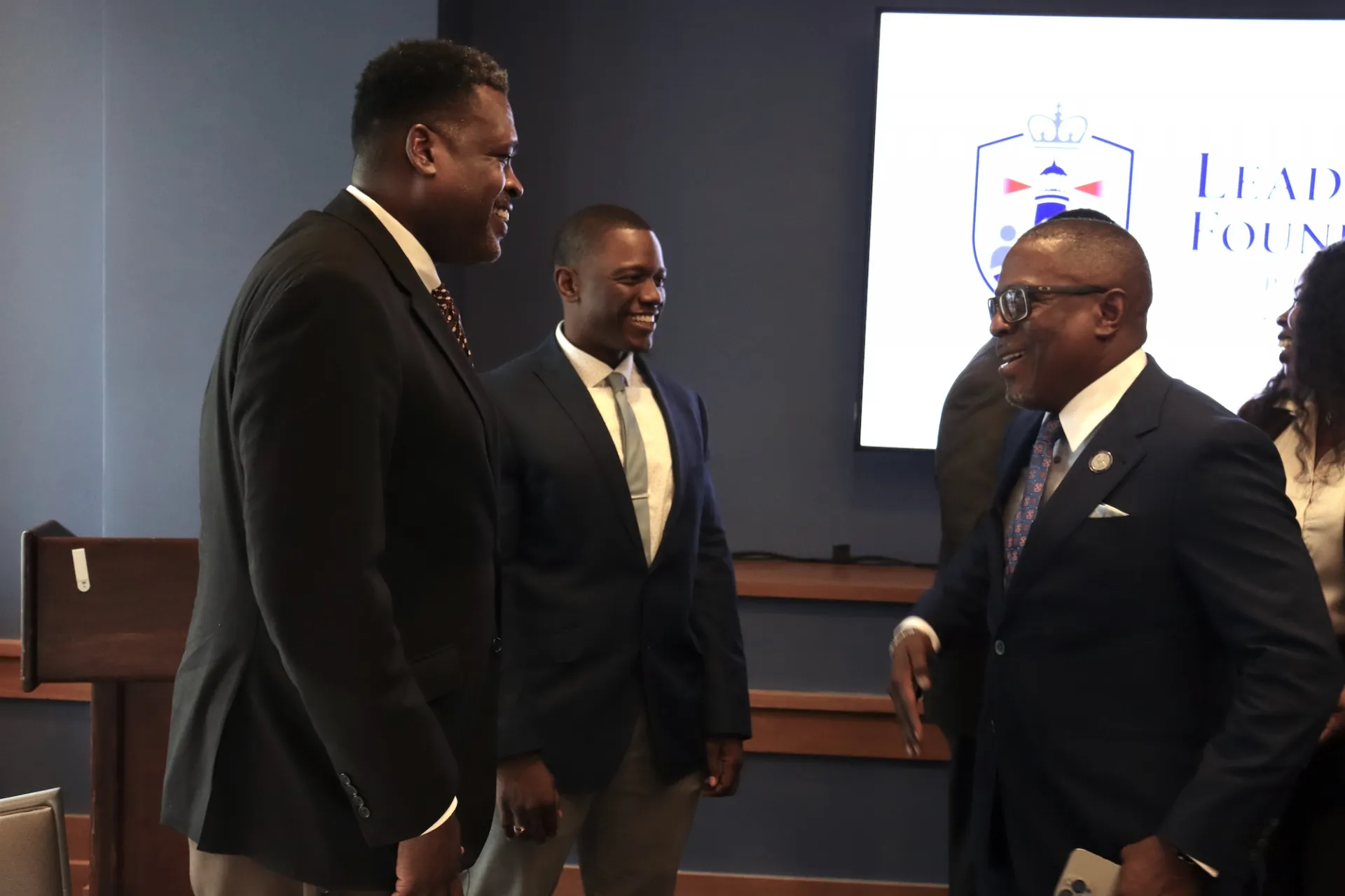 Deputy VP Brian McPherson greets two program graduates after the celebration.