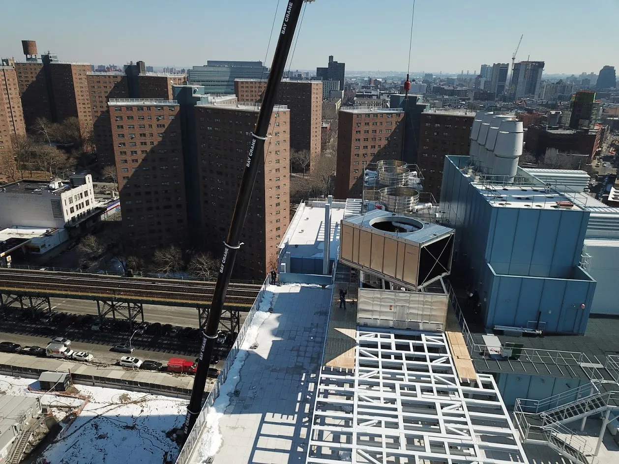 Cooling towers being loaded to the roof of the Jerome L. Green Science Center.