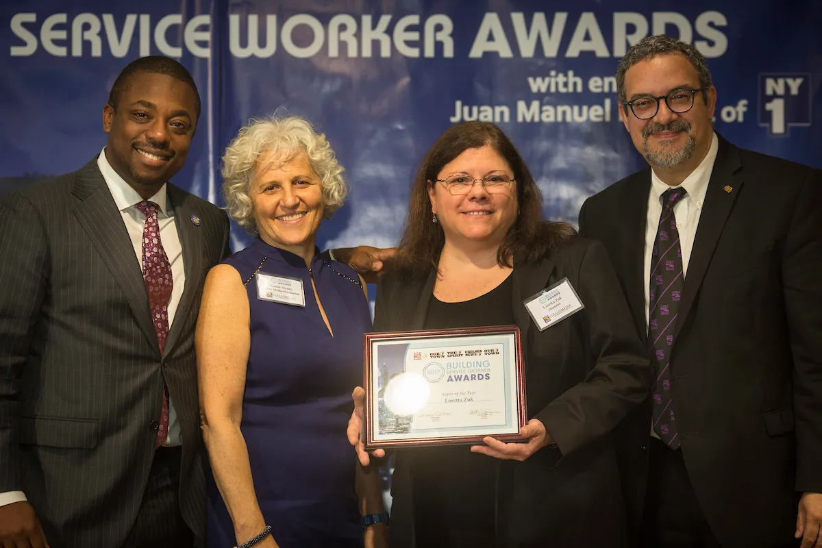 Loretta Zuk, a building superintendent at Columbia for more than 30 years, receiving the “Superintendent of the Year” award at the 11th annual Building Service Worker Awards ceremony.