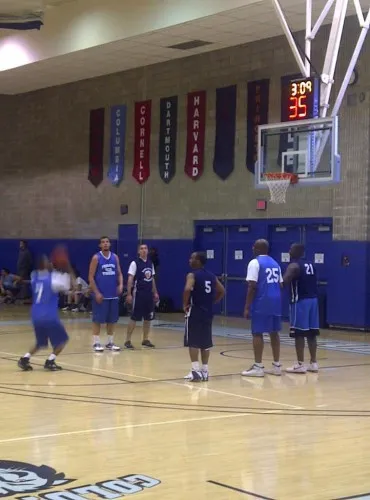 In a close semi-final game, the Facilities Tigers (light blue) squeaked by the Public Safety Enforcers (dark blue) to advance to the finals.