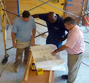 Two program mentee firms, First Choice Mechanical and Corinthian Construction Company, working together on a project at Columbia.