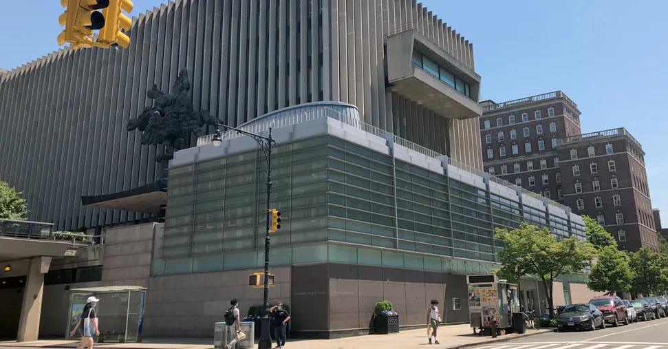A view of Jerome Greene Hall from the gates at College Walk on Amsterdam.
