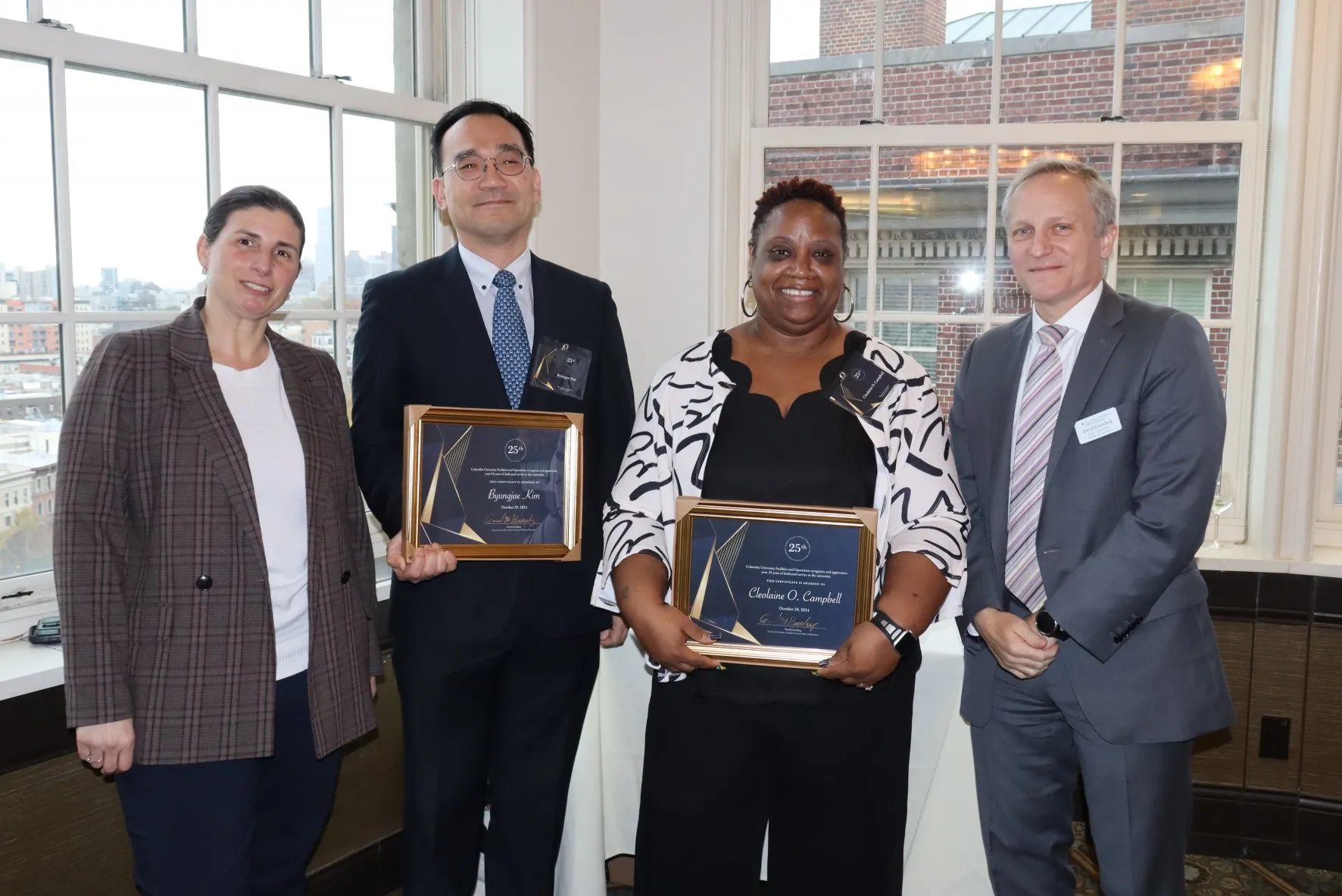 Finance and Administration employees pose with their supervisor and Executive Vice President David M. Greenberg