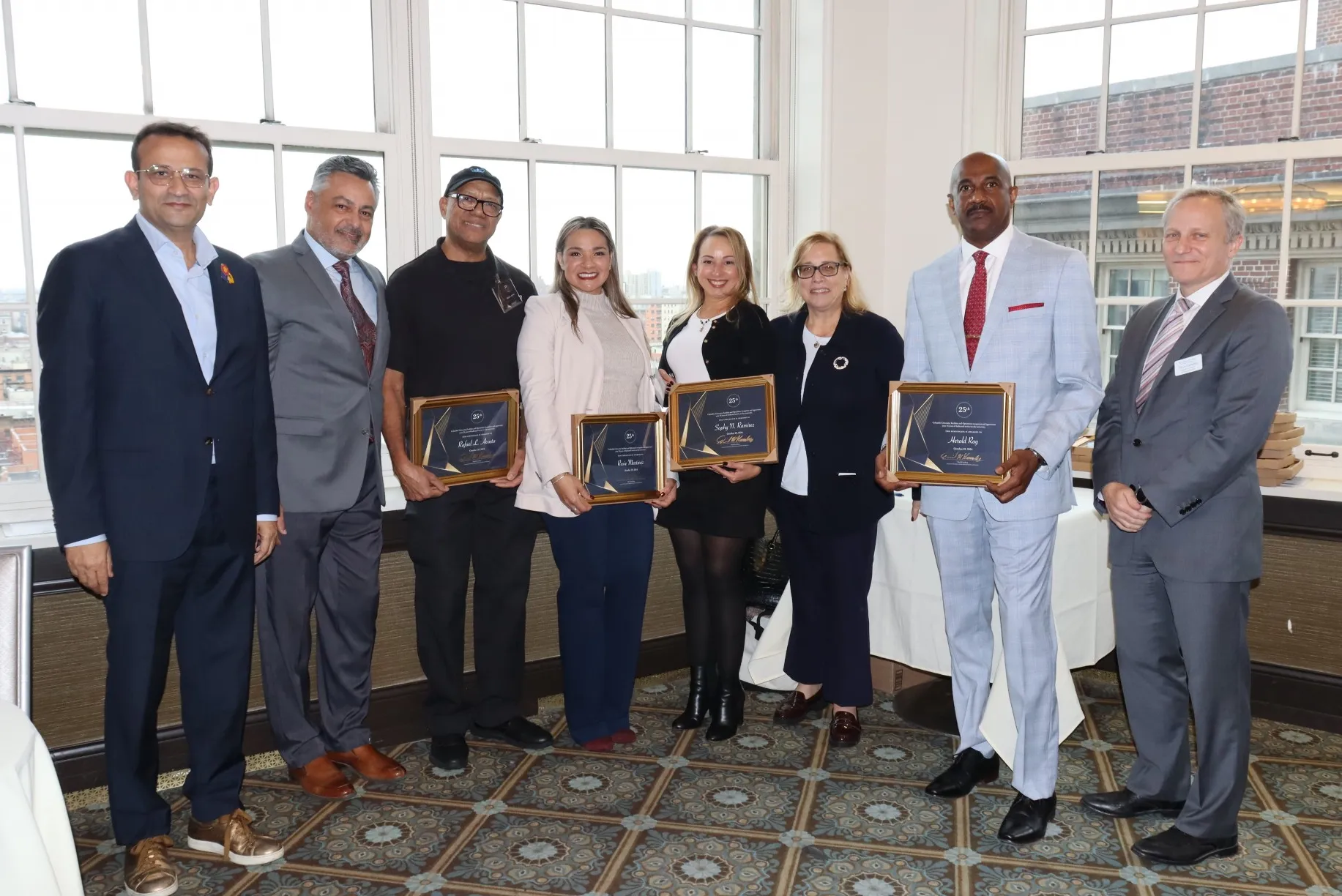 Campus Services employees pose with their supervisors and Executive Vice President David M. Greenberg