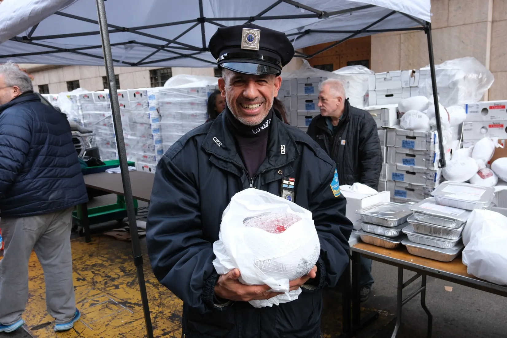 Public Safety Officer posing with turkey