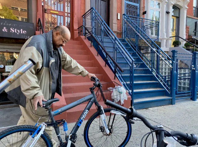 A local resident receives donated bike. 