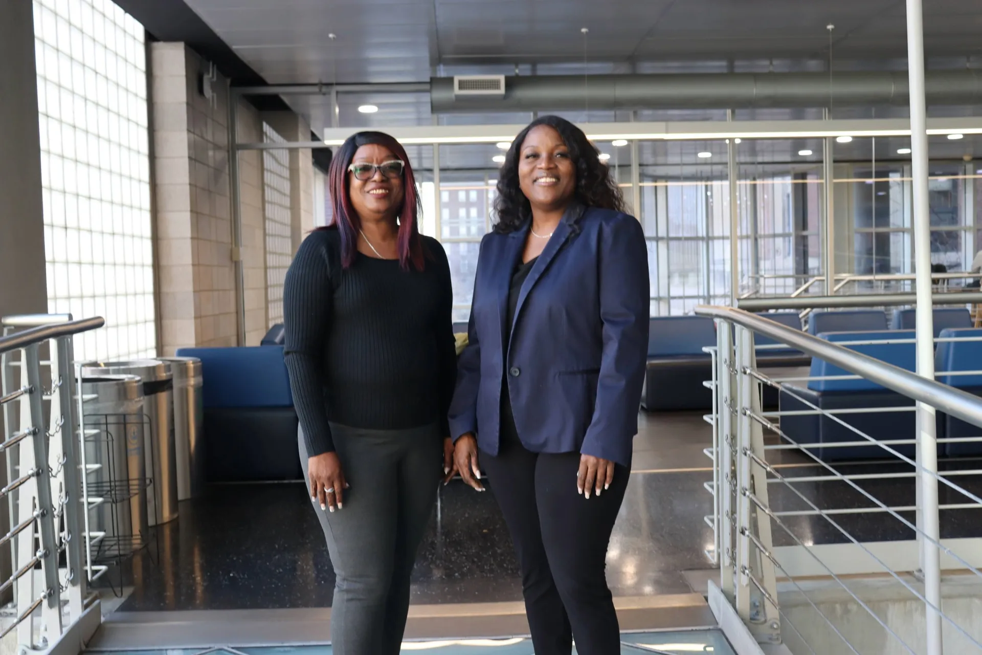 Tammie (left) and Nakia (right) stand side-by-side on the ramps of Lerner Hall