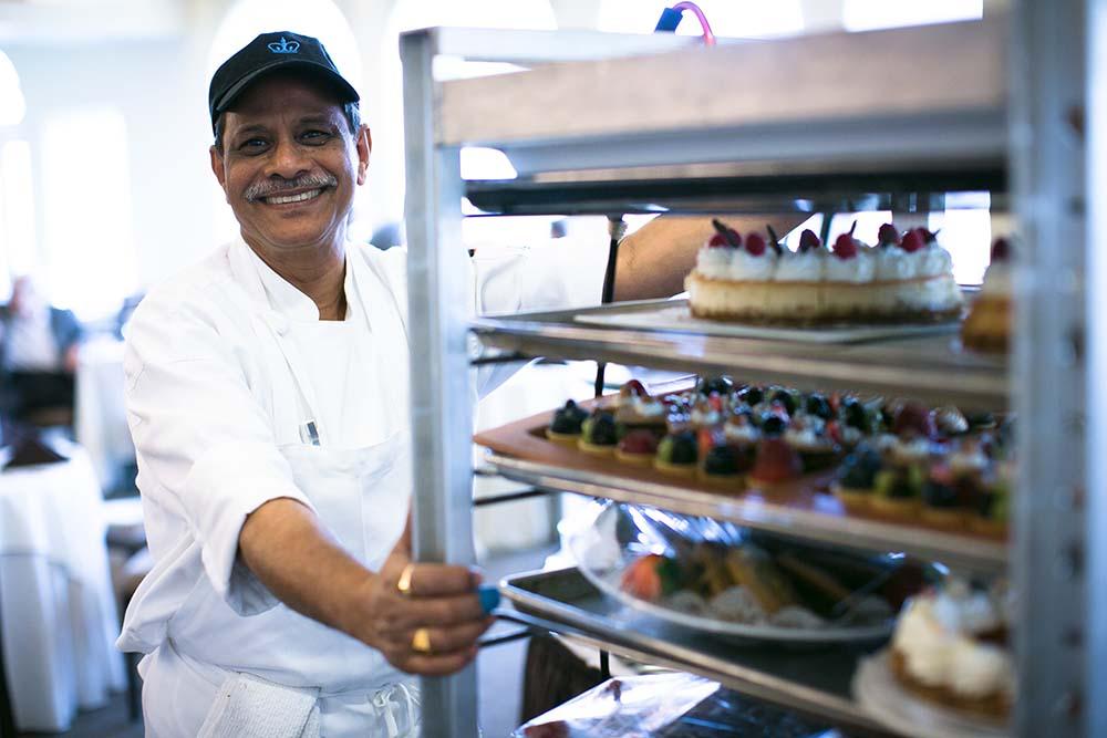 Columbia Dining employee with cart full of food