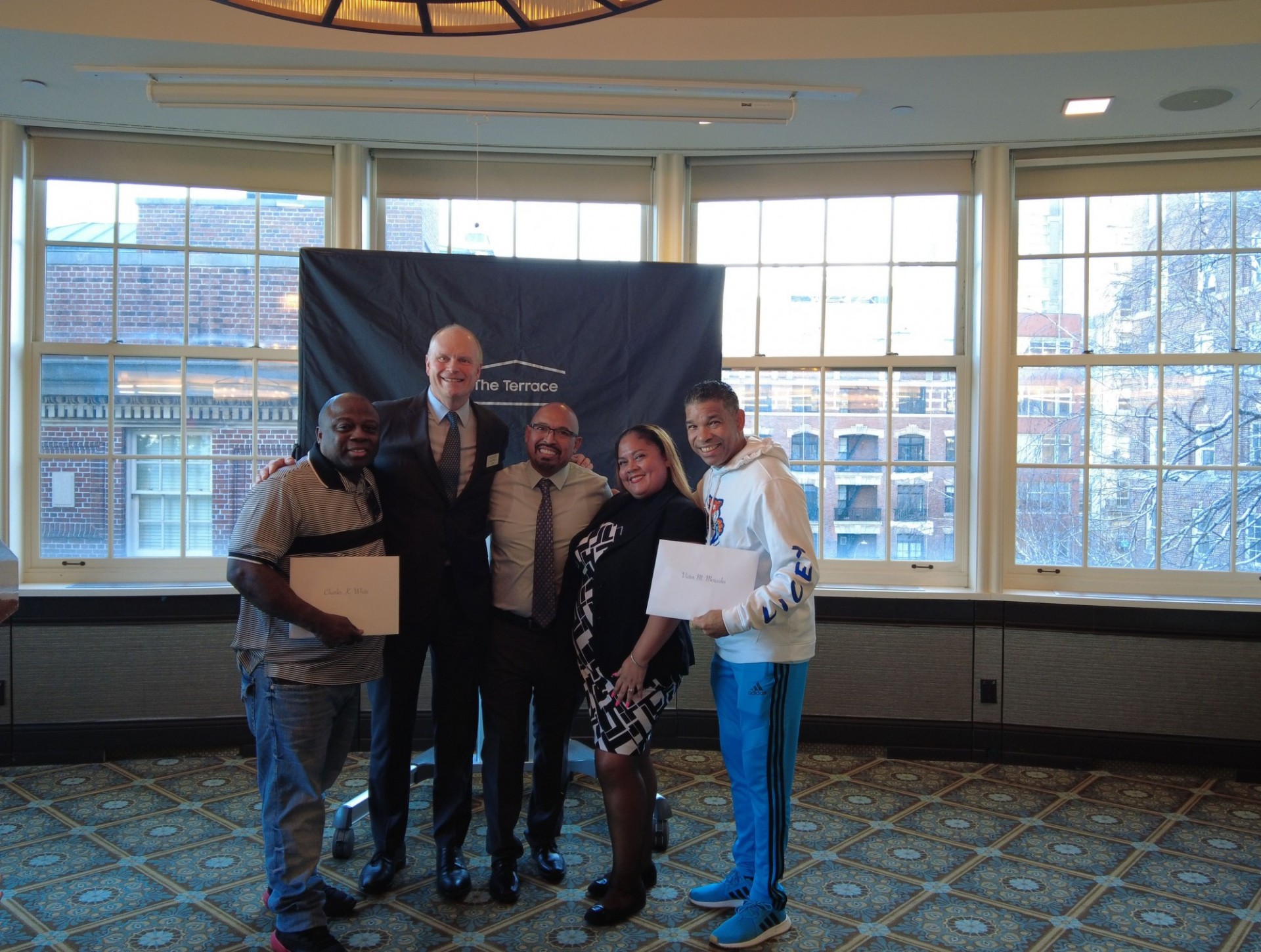 Campus Services team celebrate 25 years of service. Campus Services employees inducted into 25-year club pose for a photo
