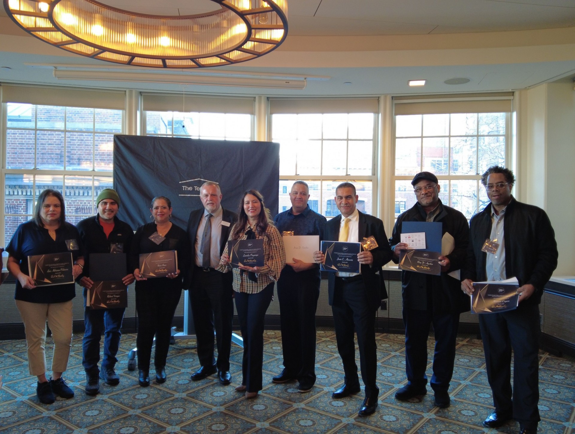 University Operations team celebrate 25 years of service. Operations employees inducted into 25-year club pose for a photo