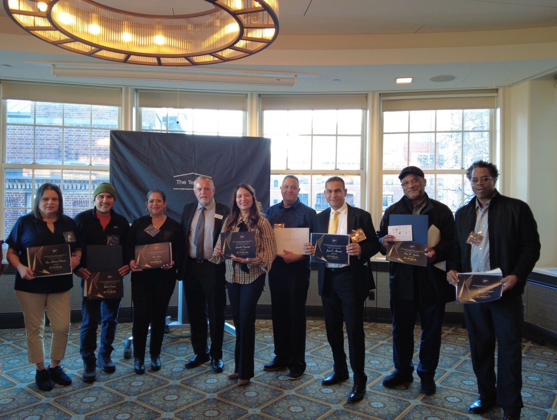 Operations employees inducted into 25-year club pose for a photo