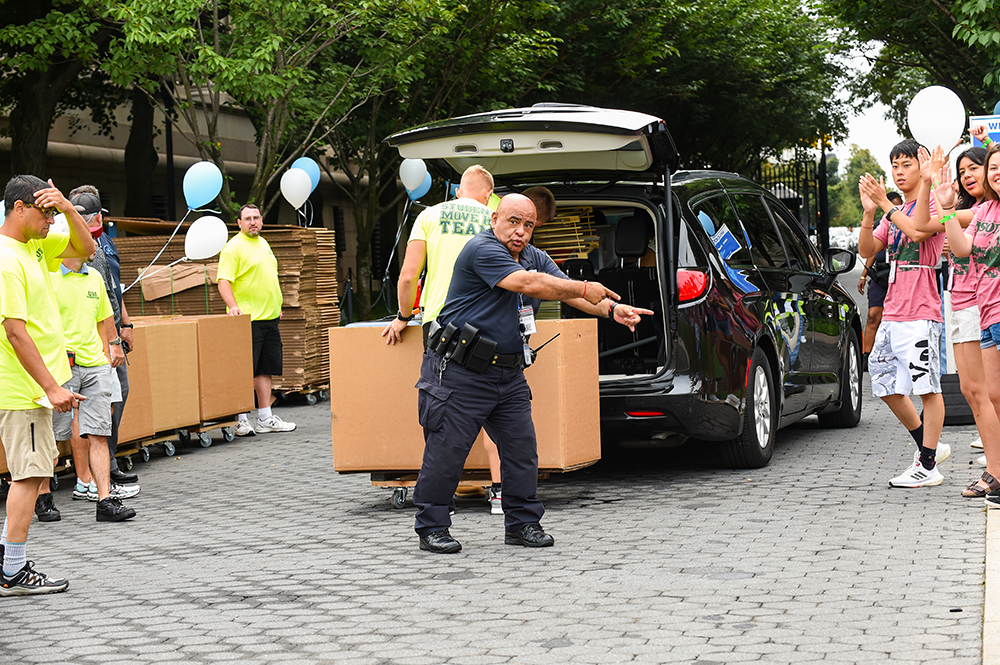 The Public Safety team helped to manage traffic on campus and direct arriving families. Photo by Diane Bondareff