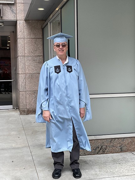 Chris Hannigan, Facilities Operations, Master of Science in Sustainability Management male in Columbia cap and gown