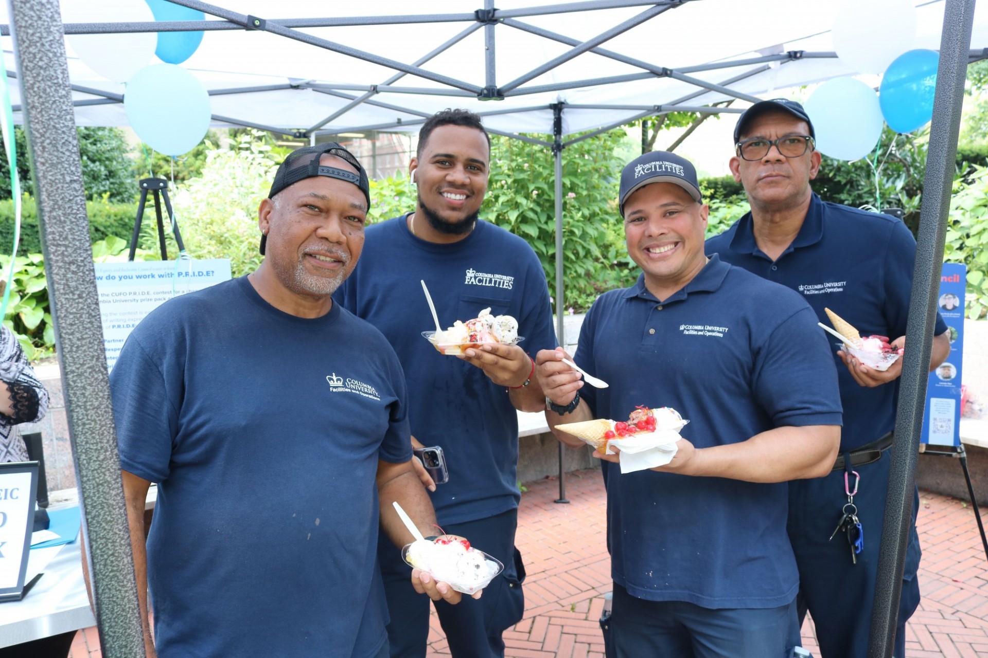 Members across the Facilities and Operations' department were invited to an ice-cream social to celebrate the one-year anniversary of the E&I Council launch. Four employees from the Operations staff pose for a photo.