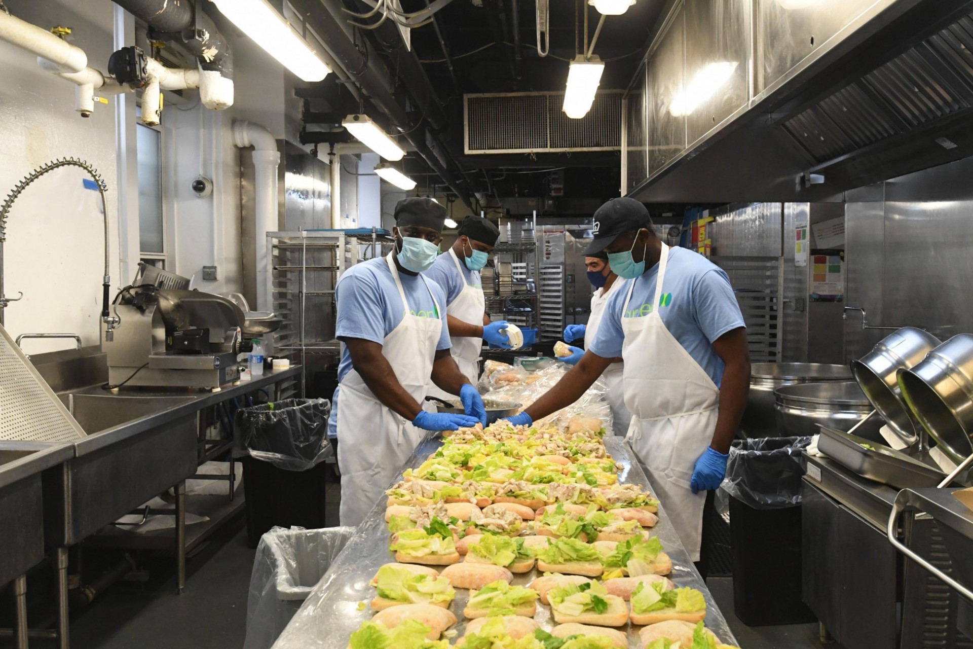 Dining staff members prepare food in John Jay Dining Hall