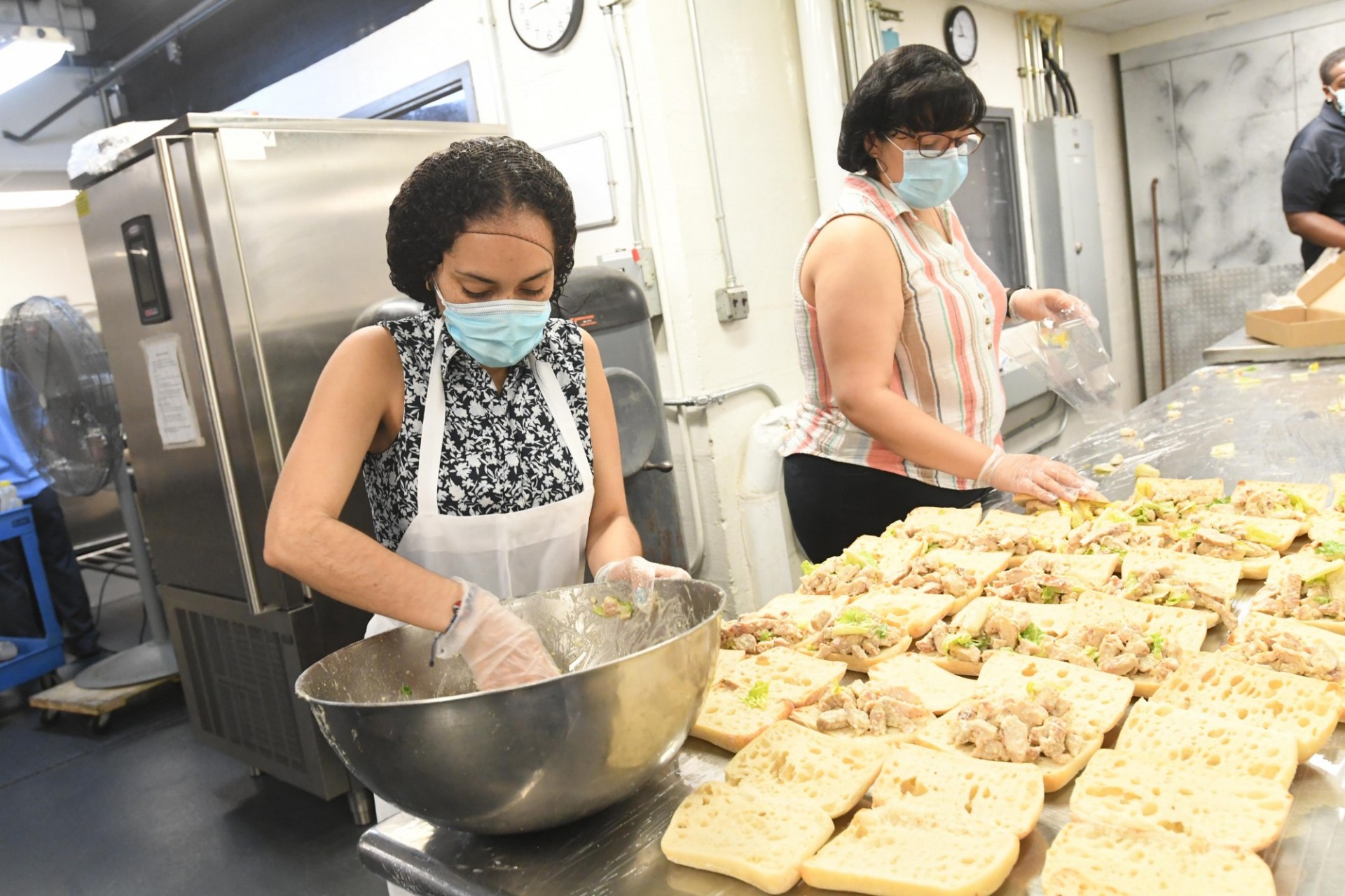 Dining staff members prepare food in John Jay Dining Hall