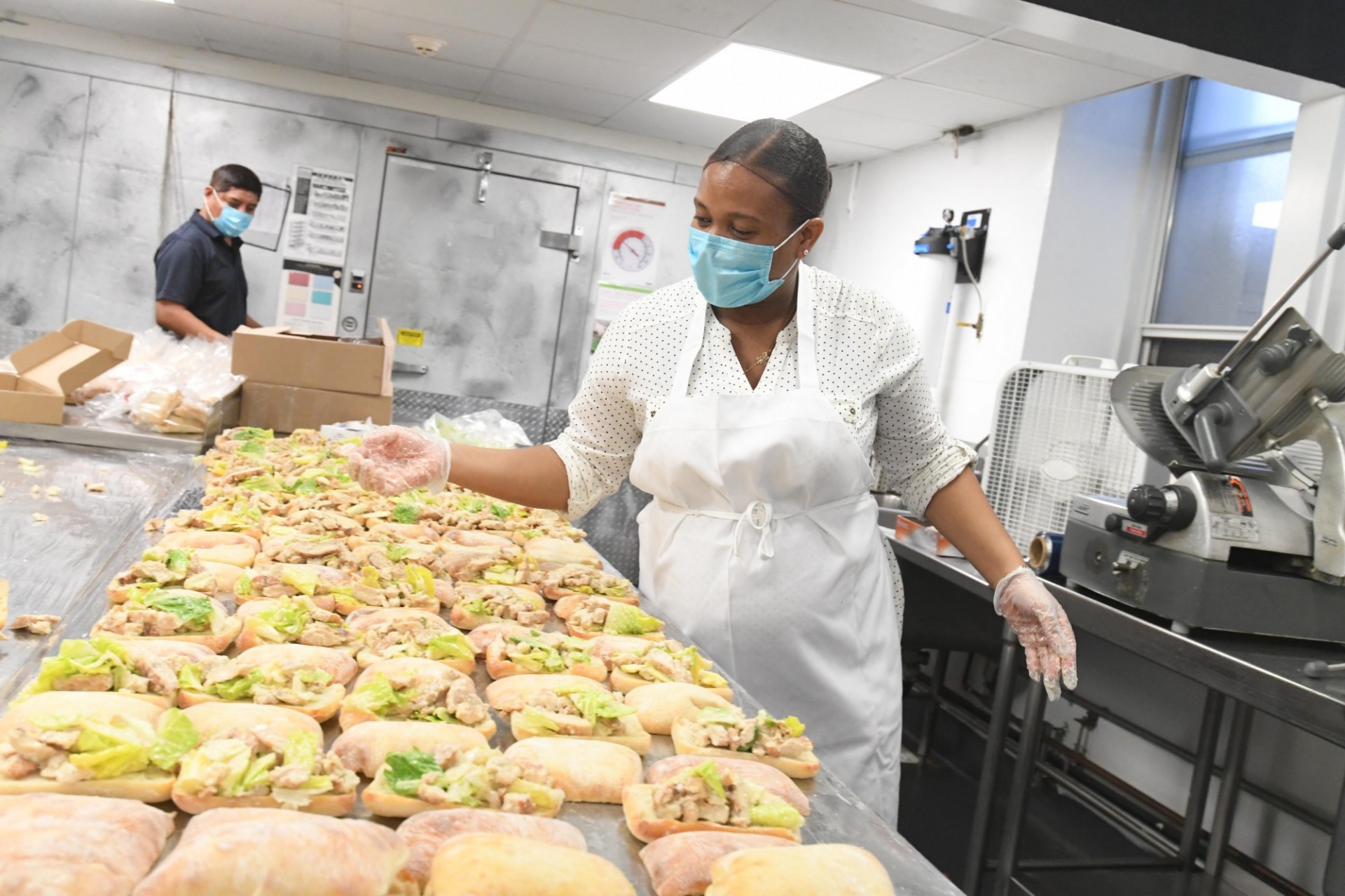 Dining staff member prepares food in John Jay Dining Hall