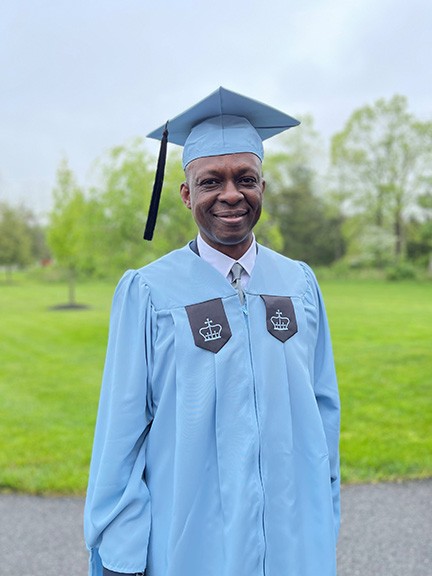male in Columbia cap and gown