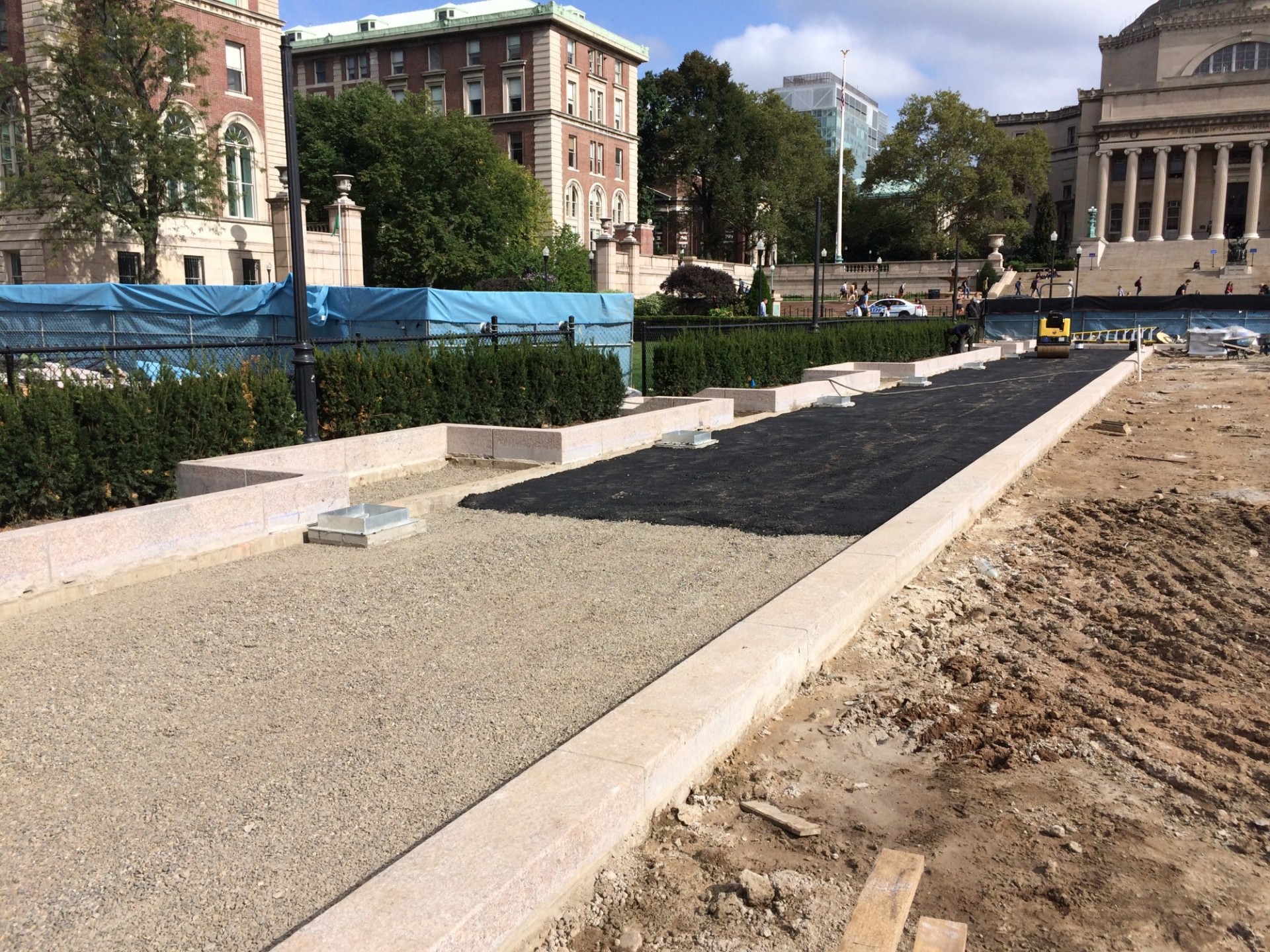 Asphalt sub-layer of the west walkway being installed over the stone sub-layer. (Photo from September 19, 2017)