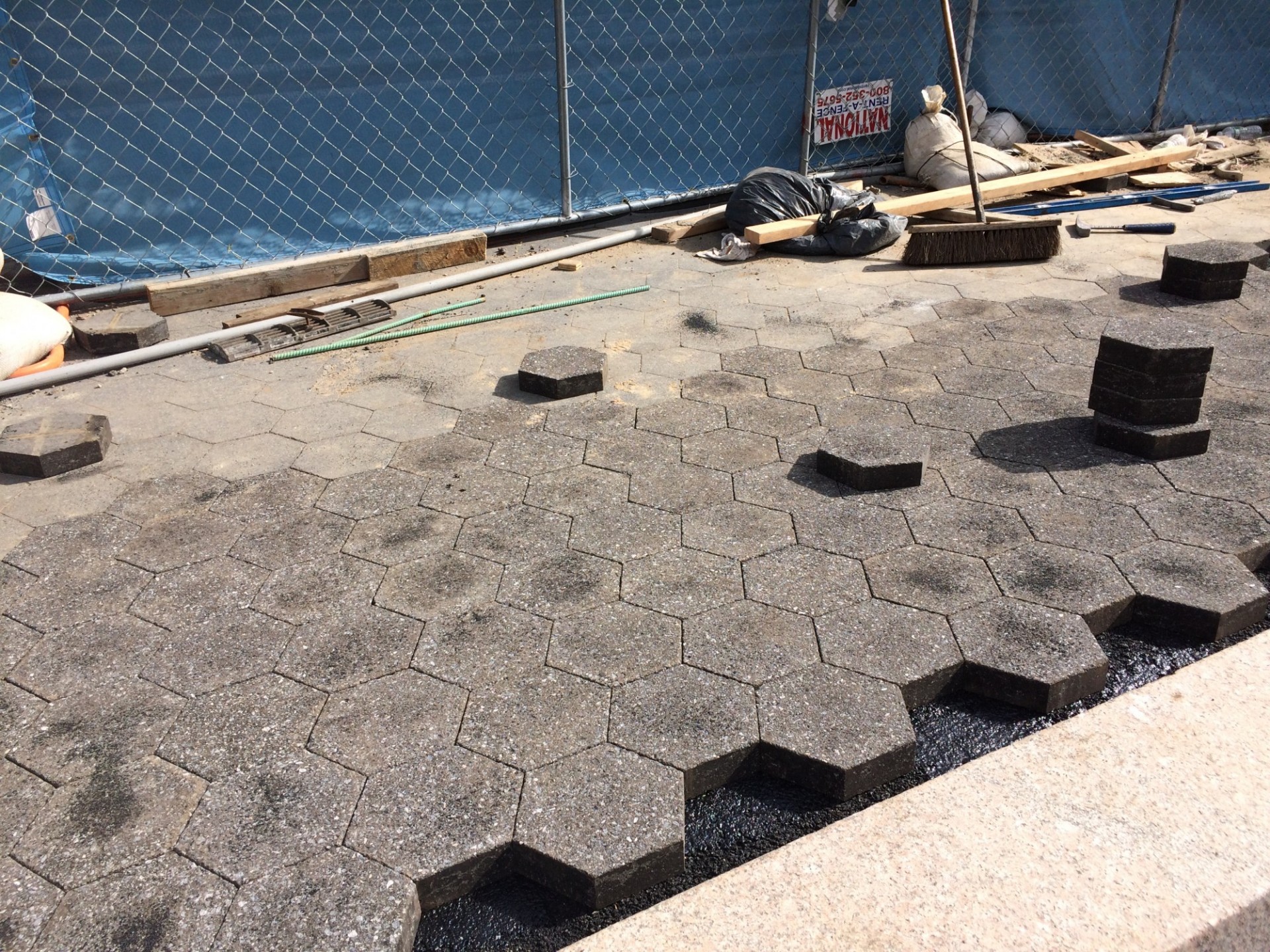Black hexagonal paver installation has begun at the north end of the site near College Walk. (Photo from September 19, 2017)