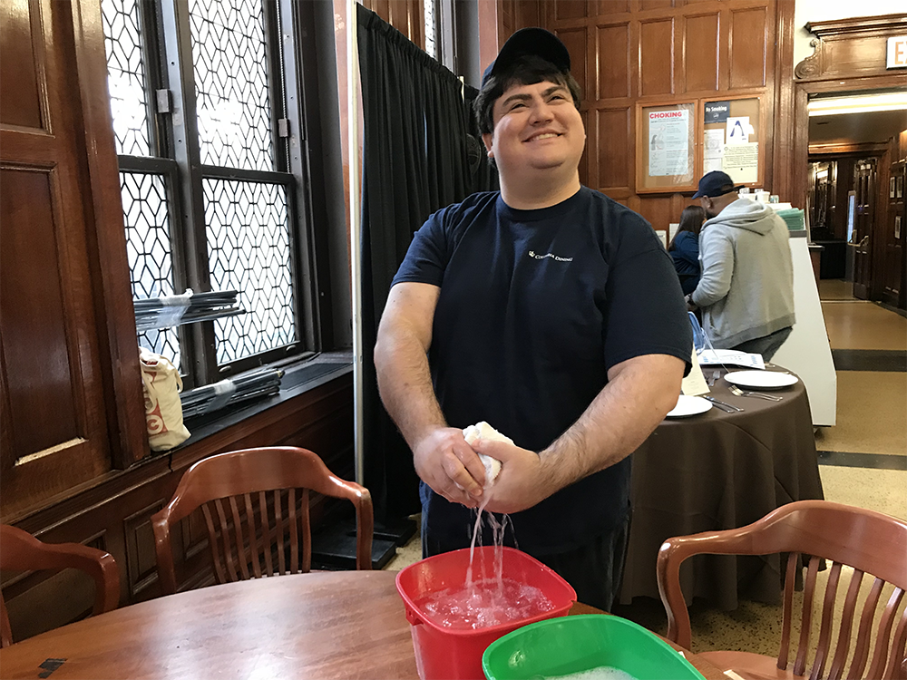 Joey cleaning tables in John Jay dining hall