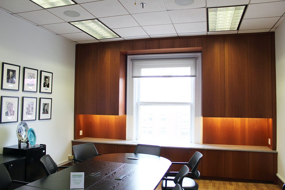 One of the many projects that took place over spring break included a new wall and custom millwork on the sixth floor of Lewisohn Hall. Conference room with wood wall
