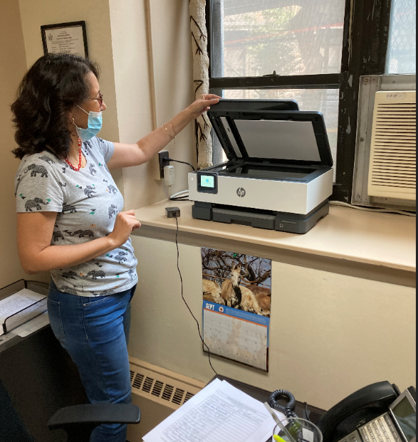 Executive Director for the Riverstone Senior Life Services Ilana Dunner poses for a photo using the new printer.