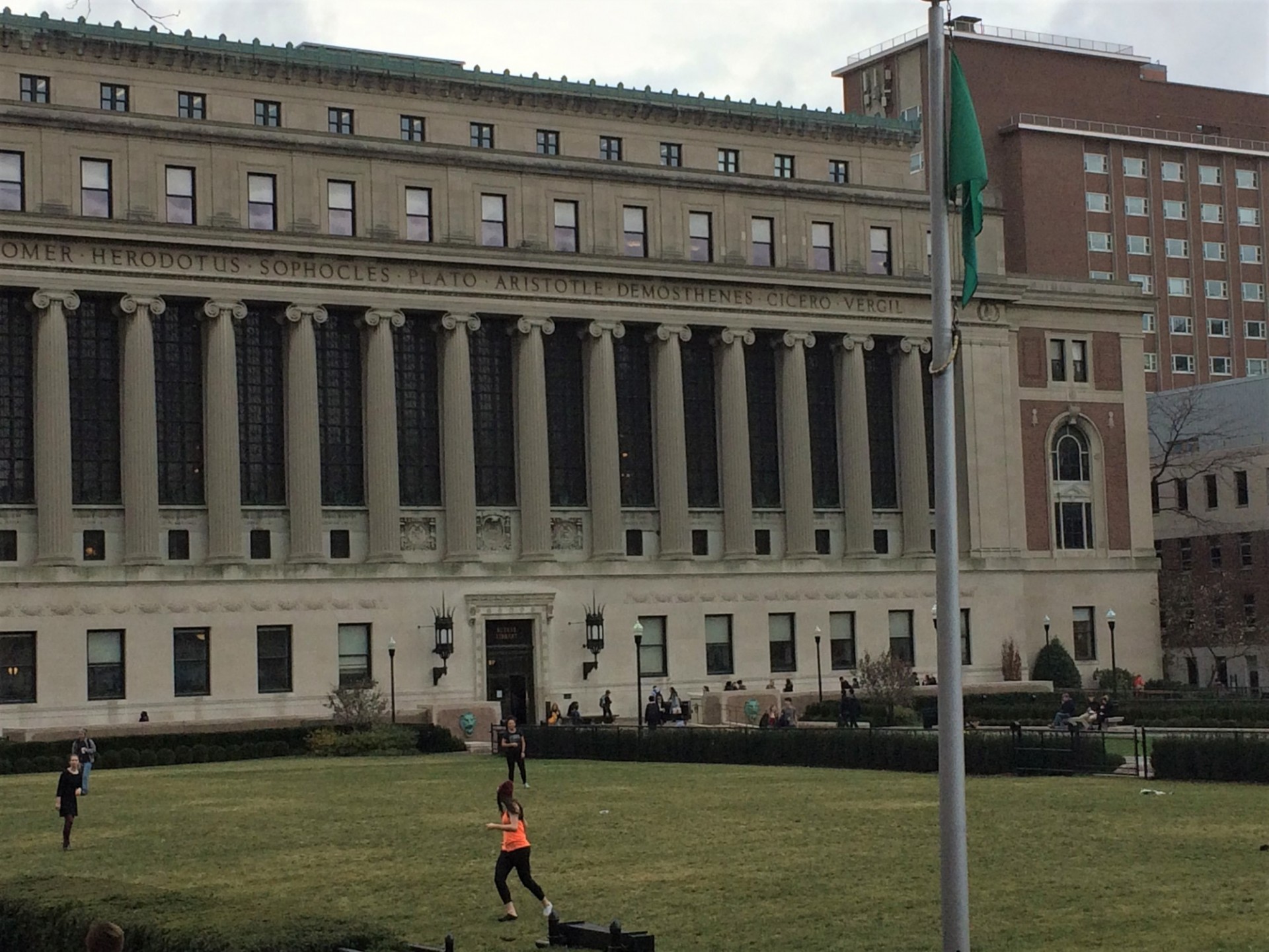 Students tossing a frisbee during one of the many green flag days in the fall 2017 semester Students tossing a frisbee during one of the many green flag days in the fall 2017 semester