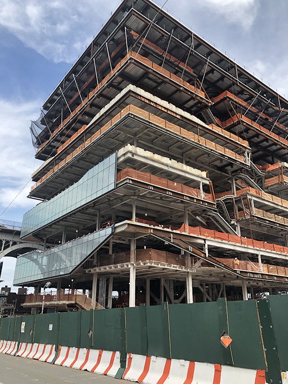 Curtain wall installation is underway at the Henry R. Kravis Building, which topped out over the summer.