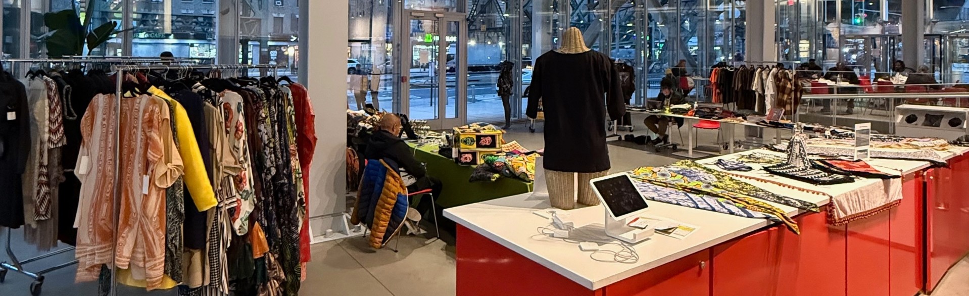 An image of the interior of the Lee C. Bollinger Forum during the SoHarlem Holiday Market. 