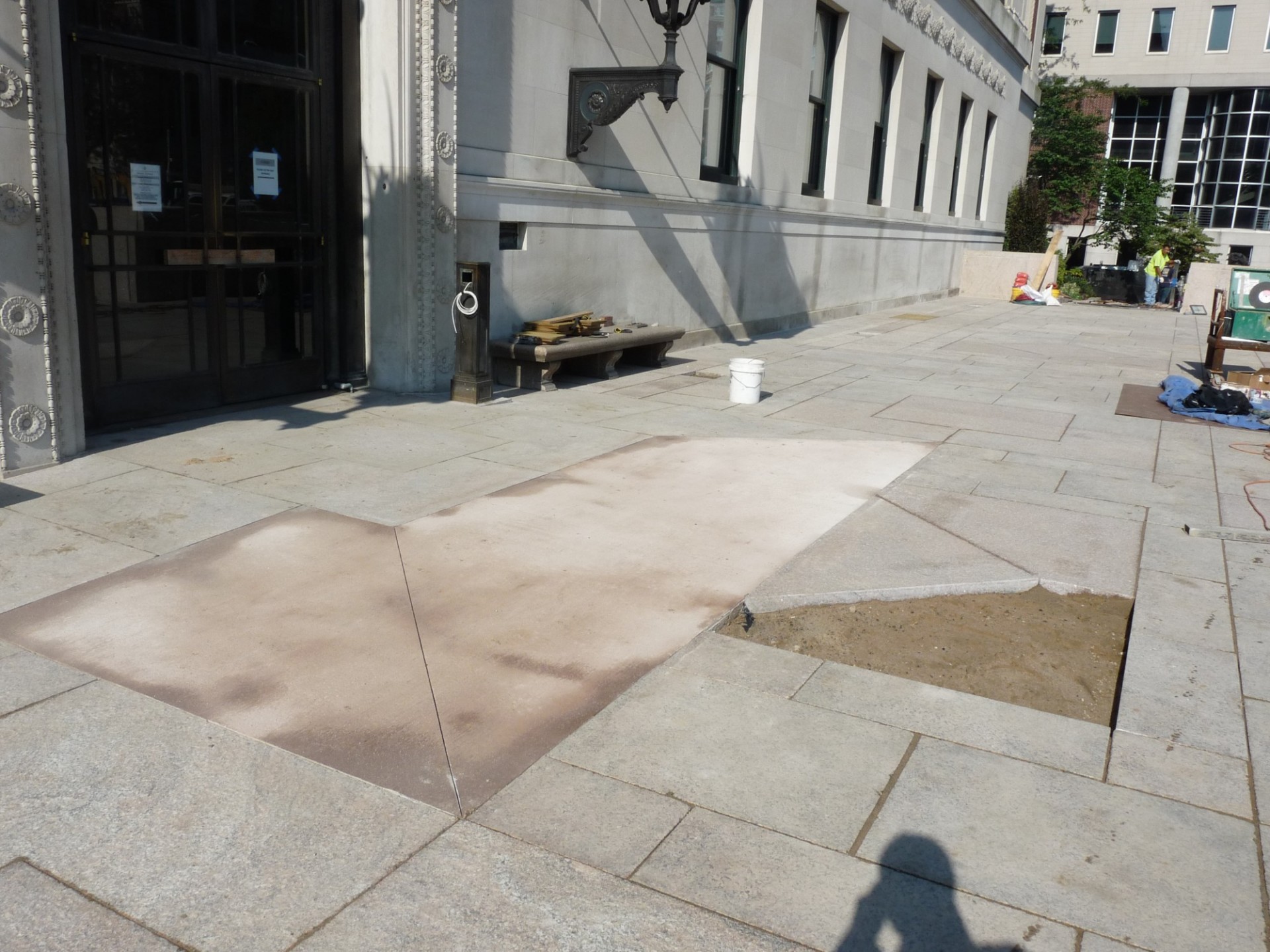 Temporary concrete has been installed in one area of Butler Plaza while we wait for granite pieces to be delivered