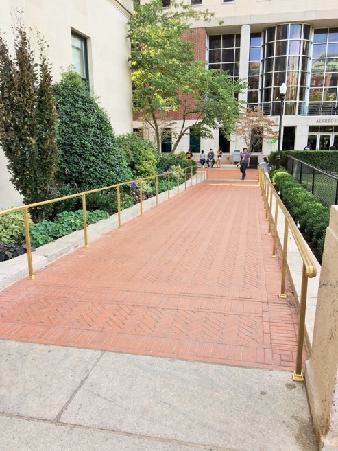 The new, sloping pathway on the west side of the library between Butler Plaza and Lerner Hall.