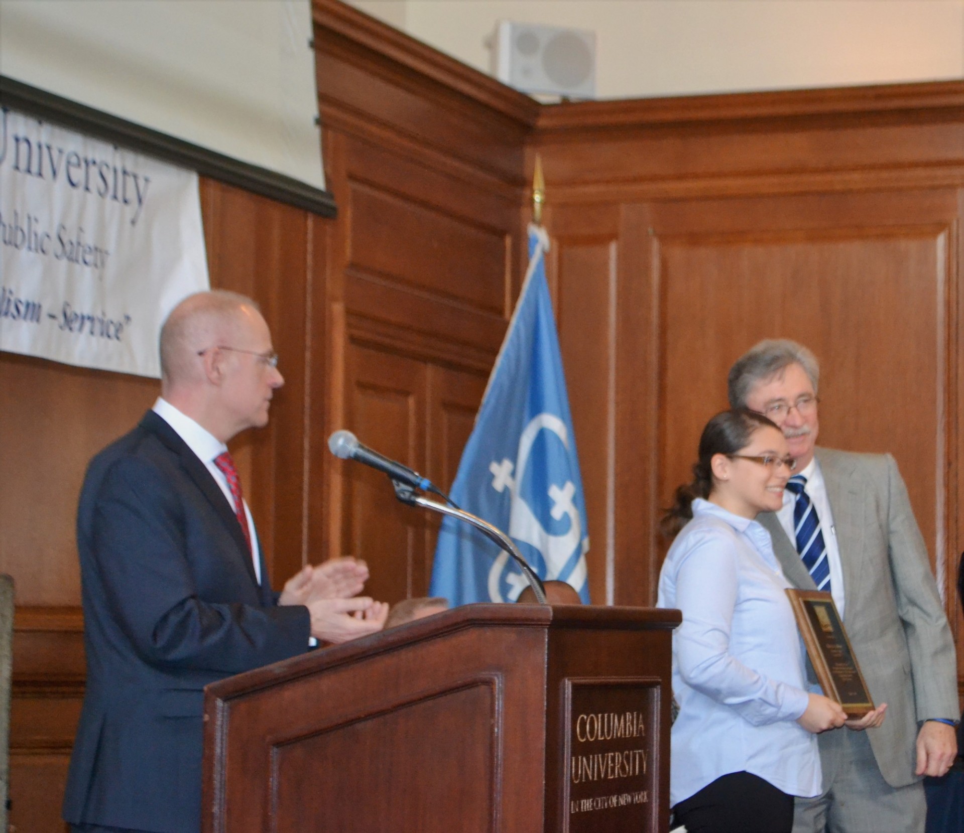 Executive Director Albert Becker presents awards during the ceremony.