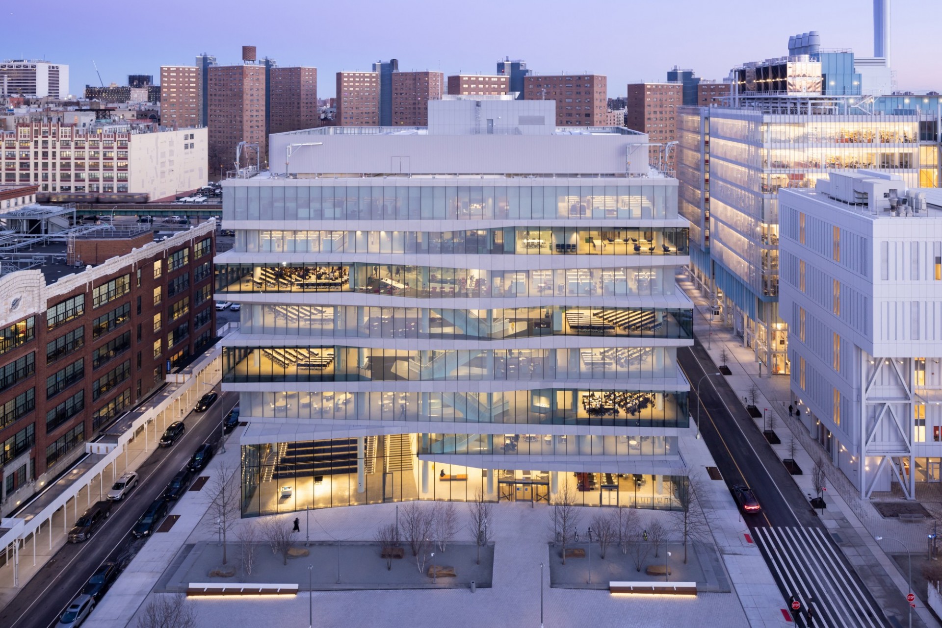 David Geffen Hall during dusk, surrounded by the Studebaker Building, Lenfest Center for the Arts, and Jerome L. Greene Science Center.