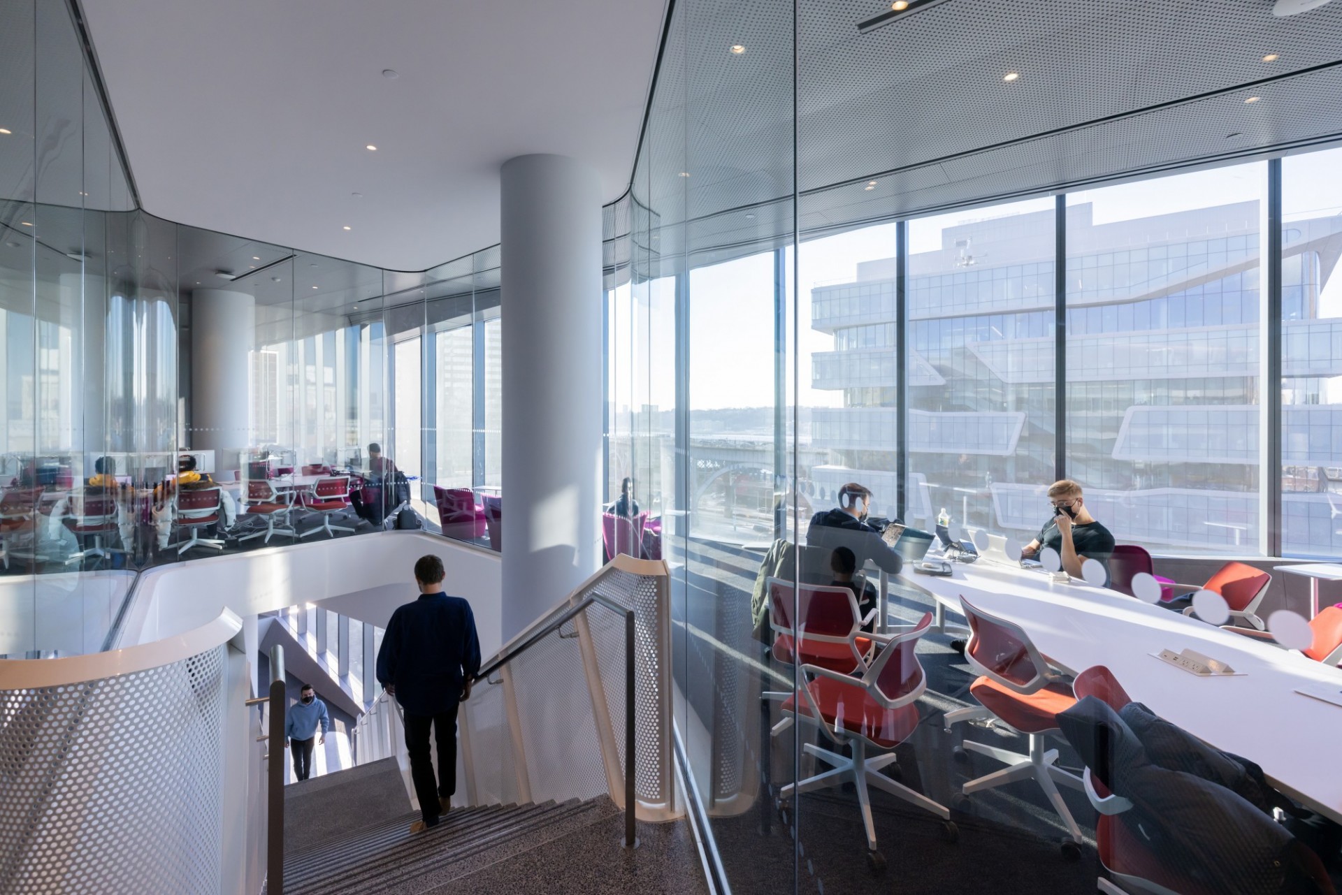 A stairwell that goes through a floor with conference rooms at David Geffen Hall.