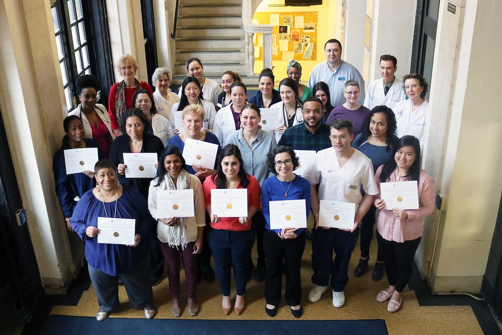 Photo of representative members of the Columbia Health team with accreditation certificates