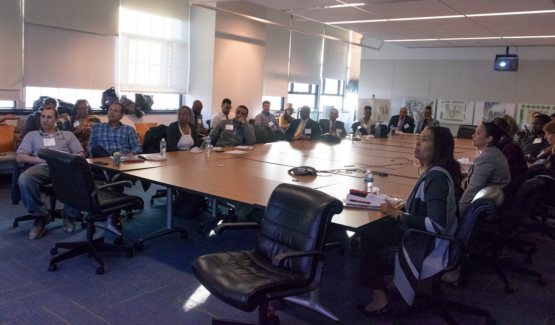 CU Grow participants and coaches listen attentively as they hear next steps from the Facilities & Operations Construction Business Initiatives team.