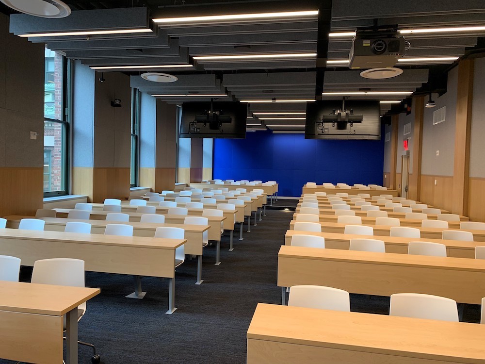 Room with rows of desks and chairs