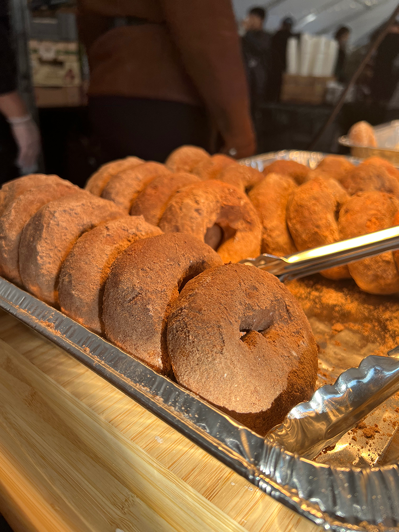 A fall favorite: cinnamon-dusted apple cider donuts Rows of apple cider donuts