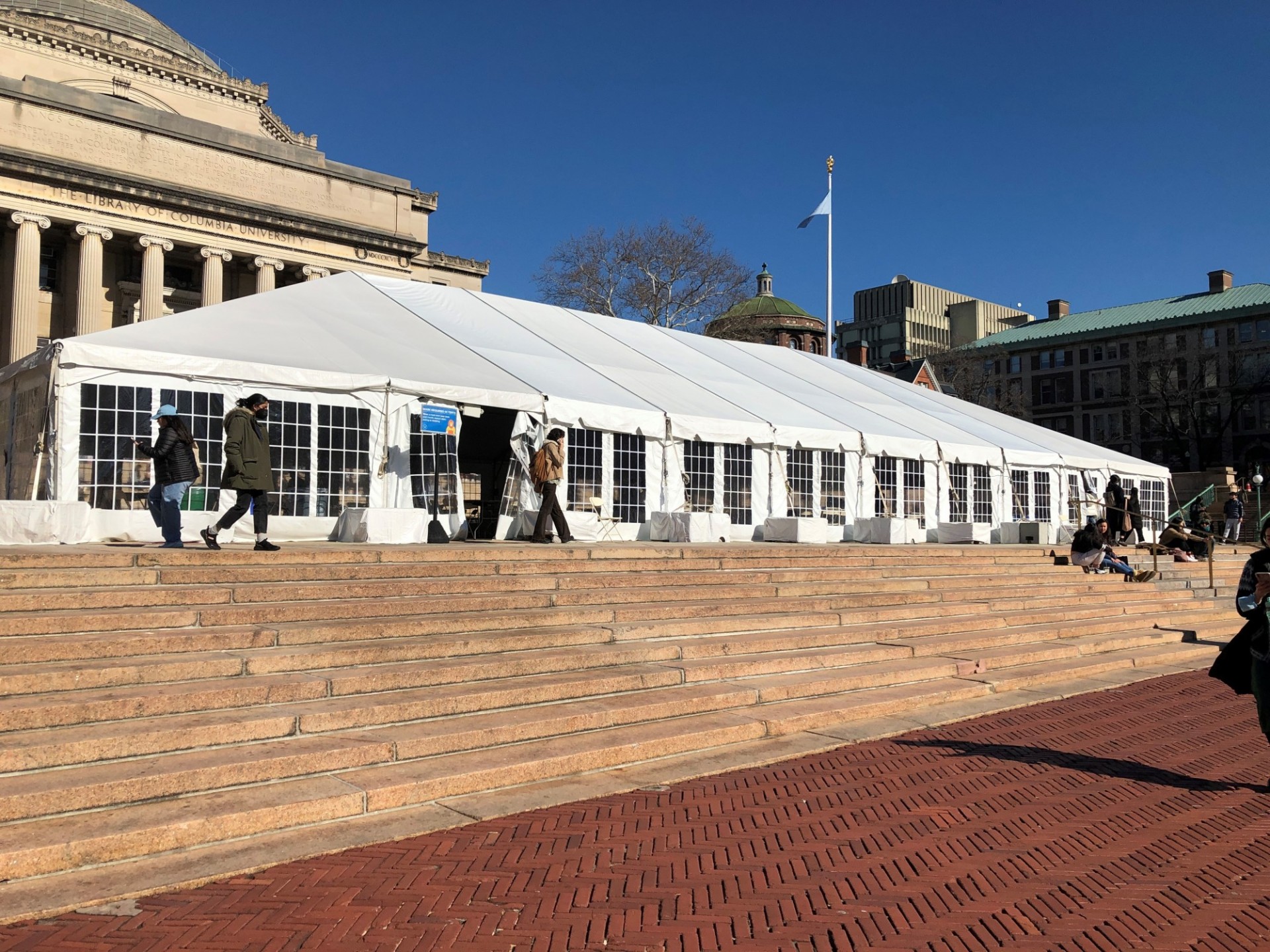 A white, outdoor tent erected at Low Plaza