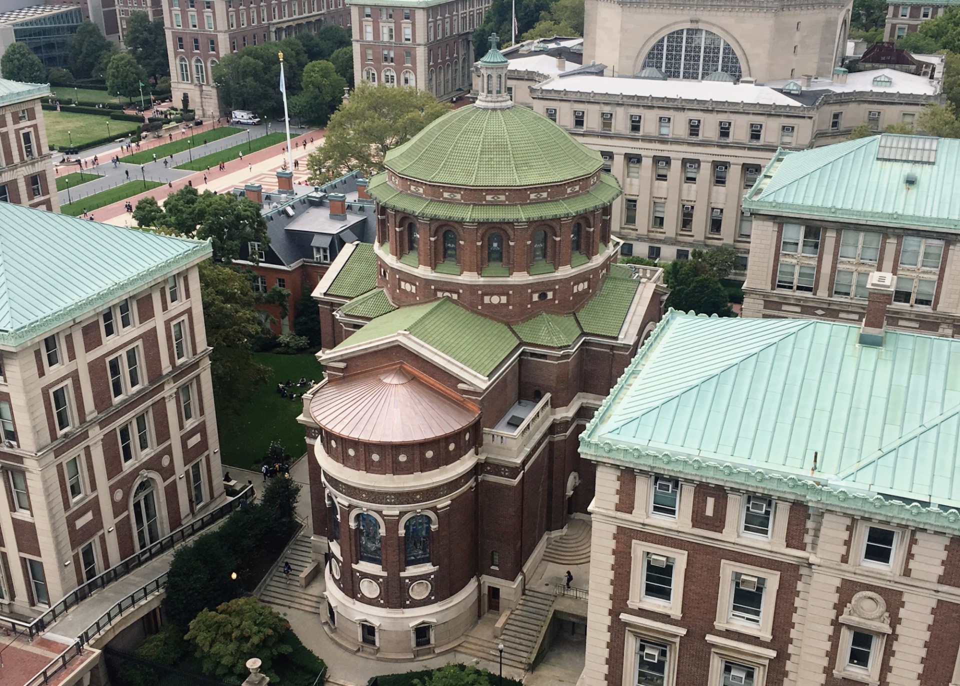 Aerial view of St. Paul's Chapel, a brick building with a green terra cotta roof.